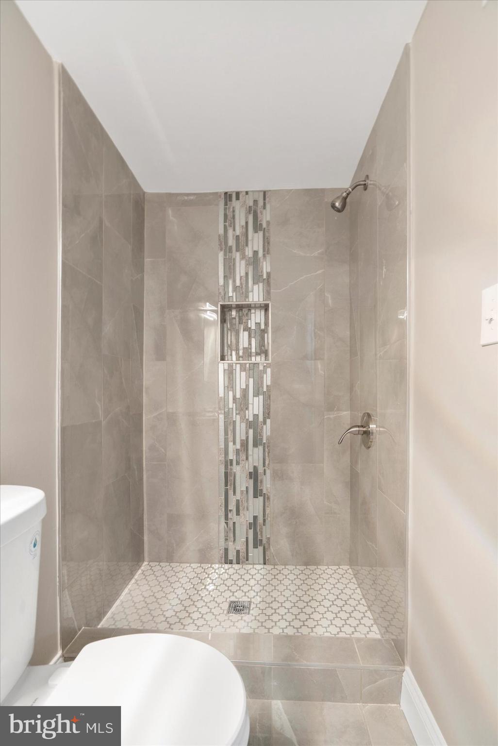 2901 Edison Highway Baltimore, MD 21213 - Photo 27 of 52 a bathroom with a shower and a toilet