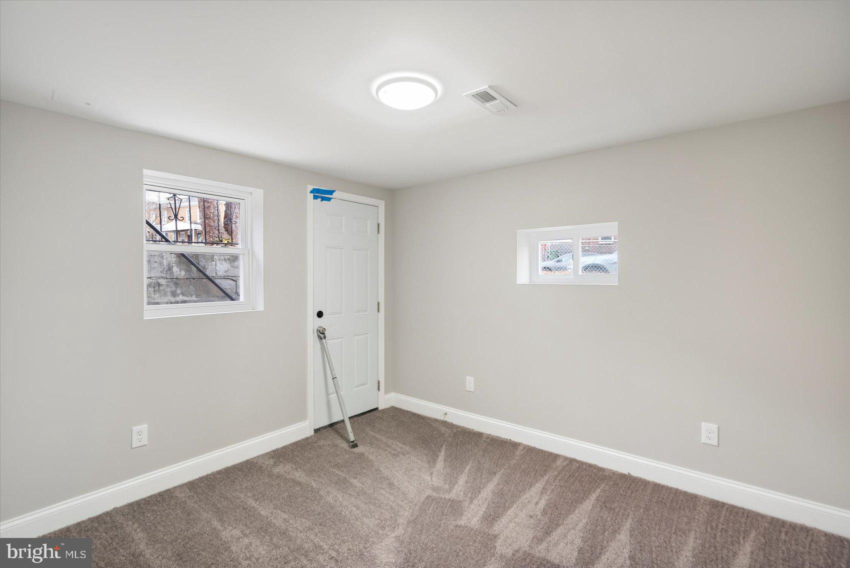 2901 Edison Highway Baltimore, MD 21213 - Photo 29 of 52 a view of an empty room with a window
