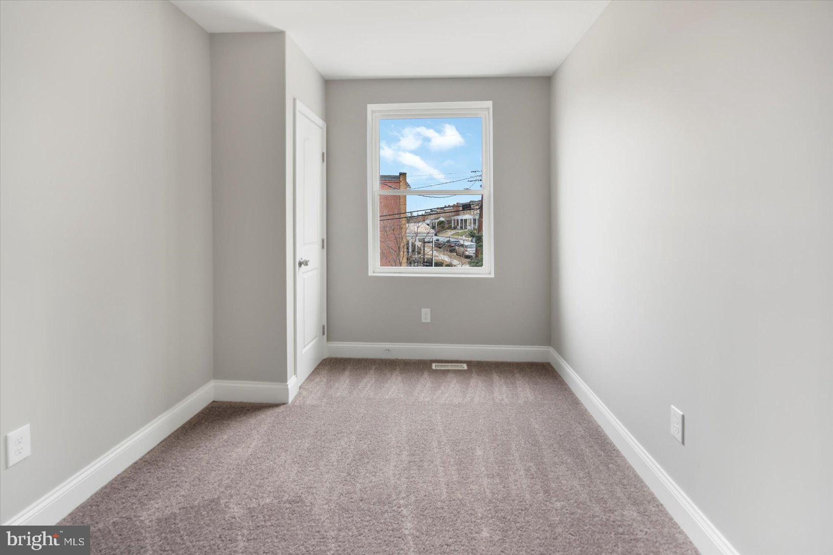 2901 Edison Highway Baltimore, MD 21213 - Photo 32 of 52 an empty room with a window