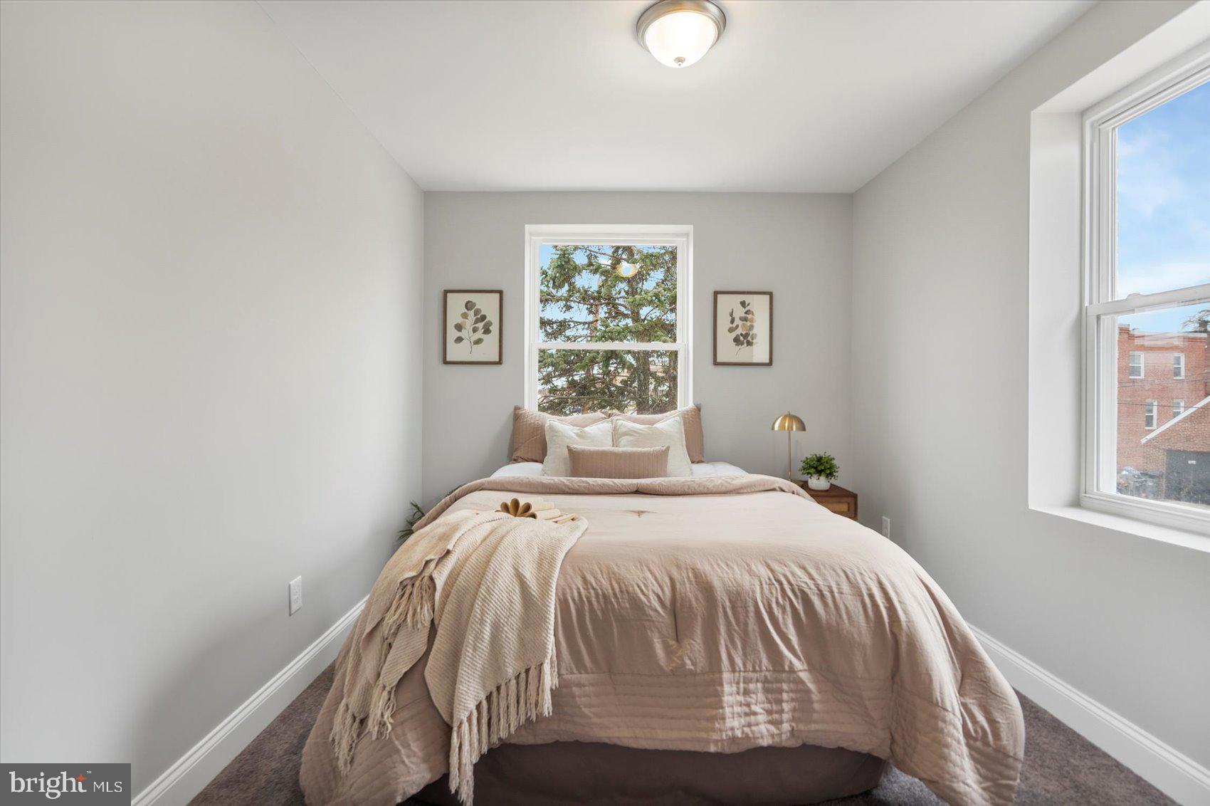 2901 Edison Highway Baltimore, MD 21213 - Photo 34 of 52 a bedroom with a bed and a window