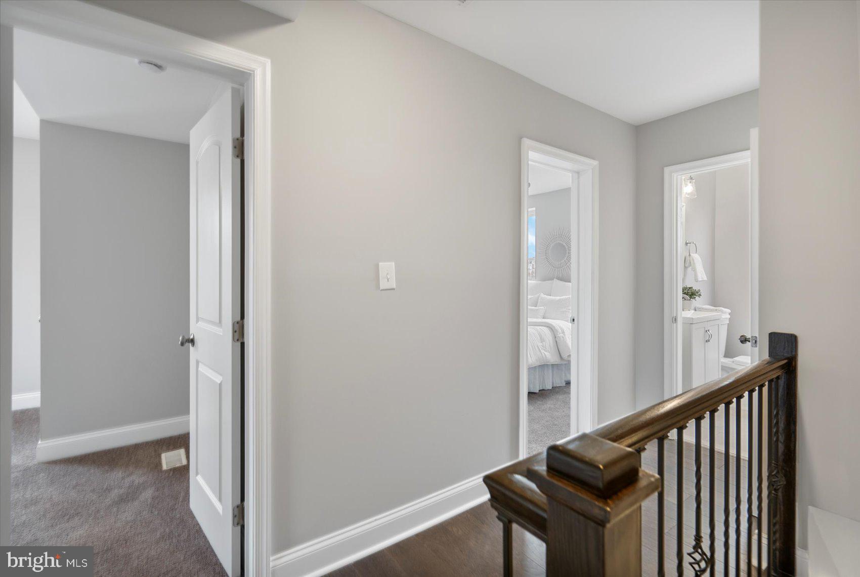2901 Edison Highway Baltimore, MD 21213 - Photo 37 of 52 a view of a hallway with wooden floor and staircase