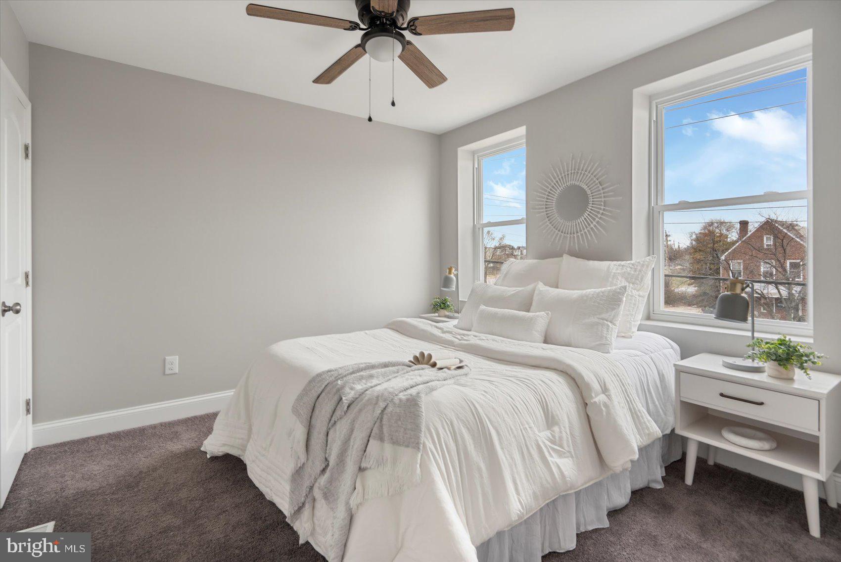 2901 Edison Highway Baltimore, MD 21213 - Photo 38 of 52 a bedroom with a bed and painting on the wall