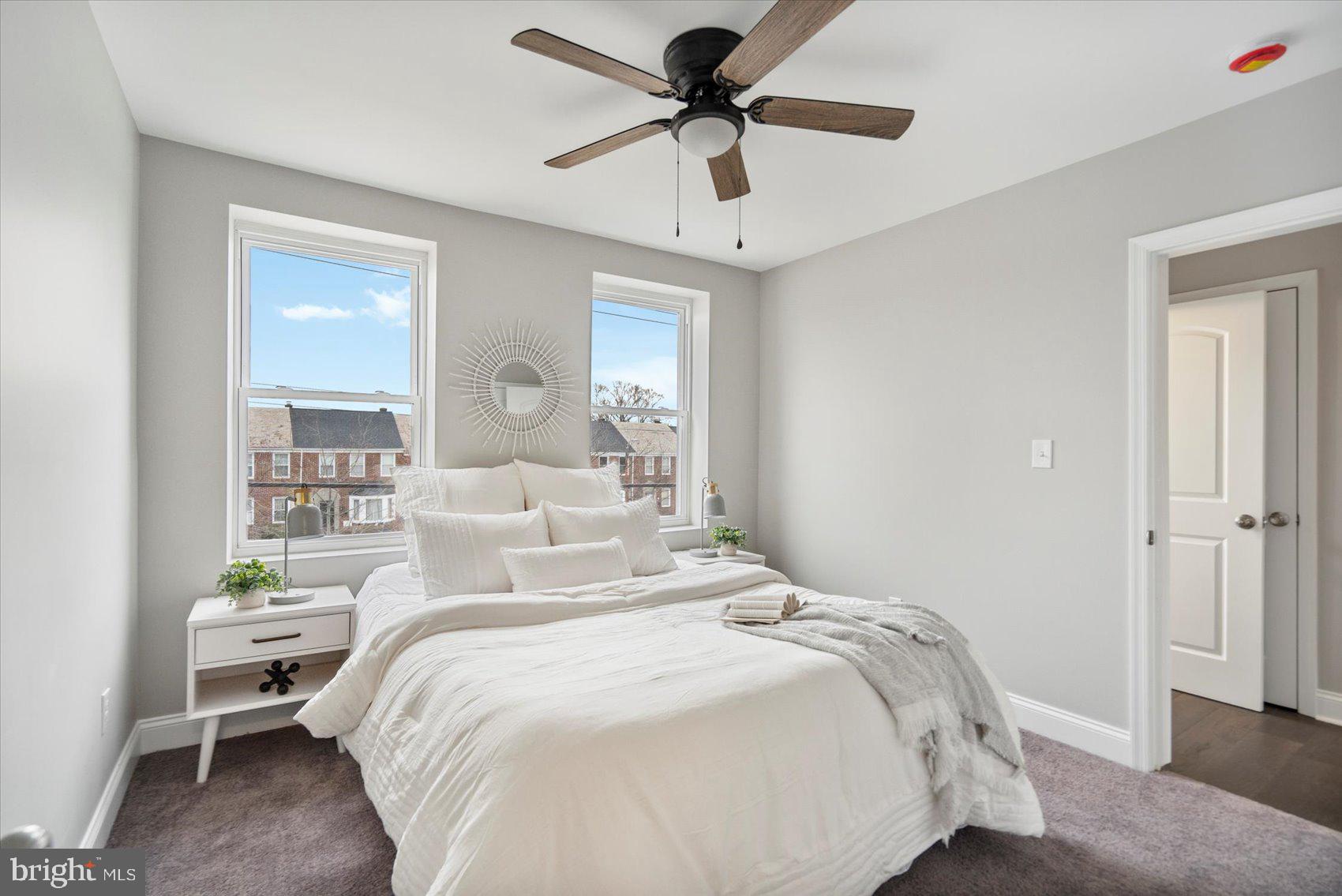 2901 Edison Highway Baltimore, MD 21213 - Photo 39 of 52 a bedroom with a bed and a chandelier