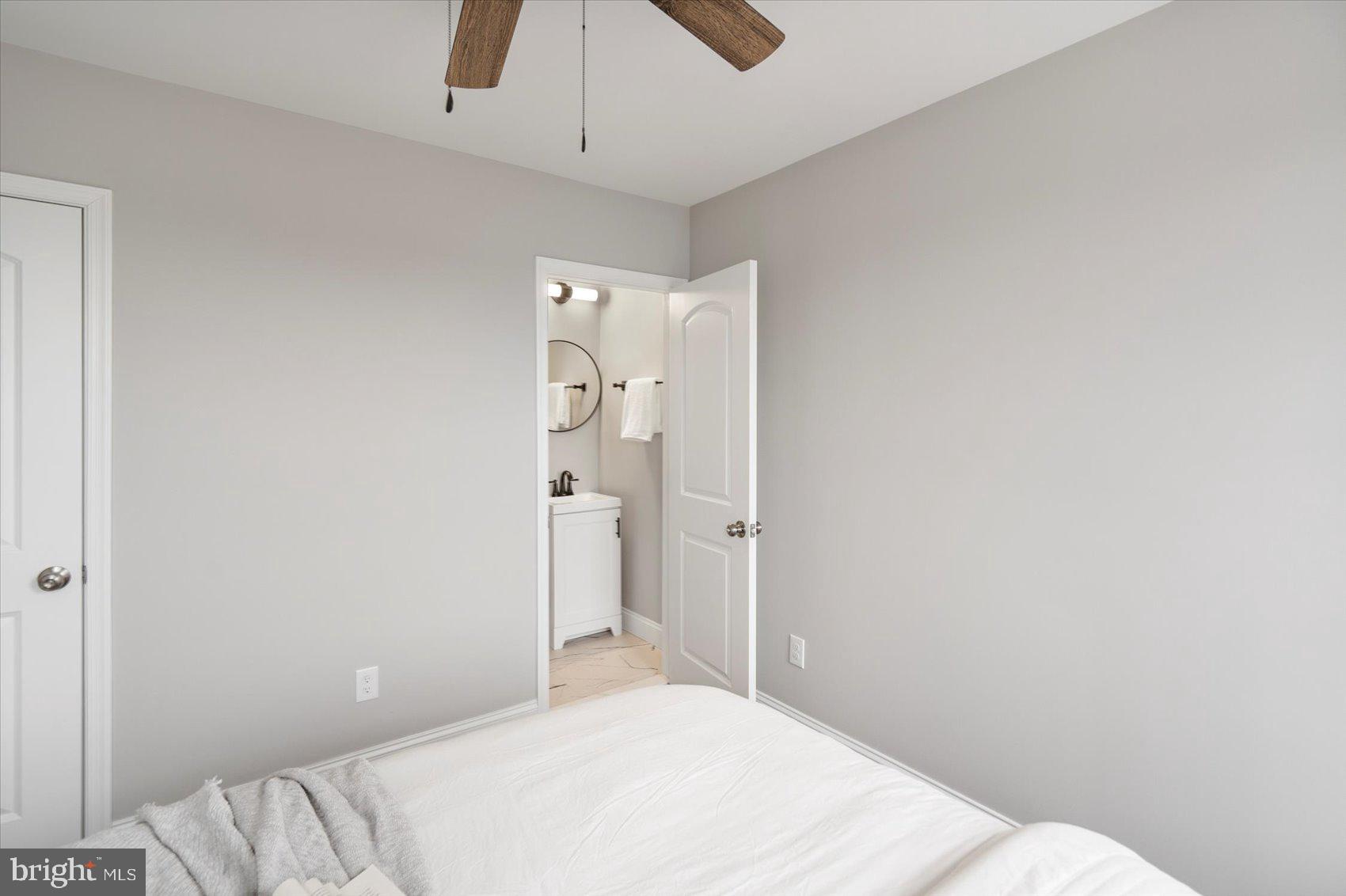 2901 Edison Highway Baltimore, MD 21213 - Photo 40 of 52 a bedroom with a bed and a shower