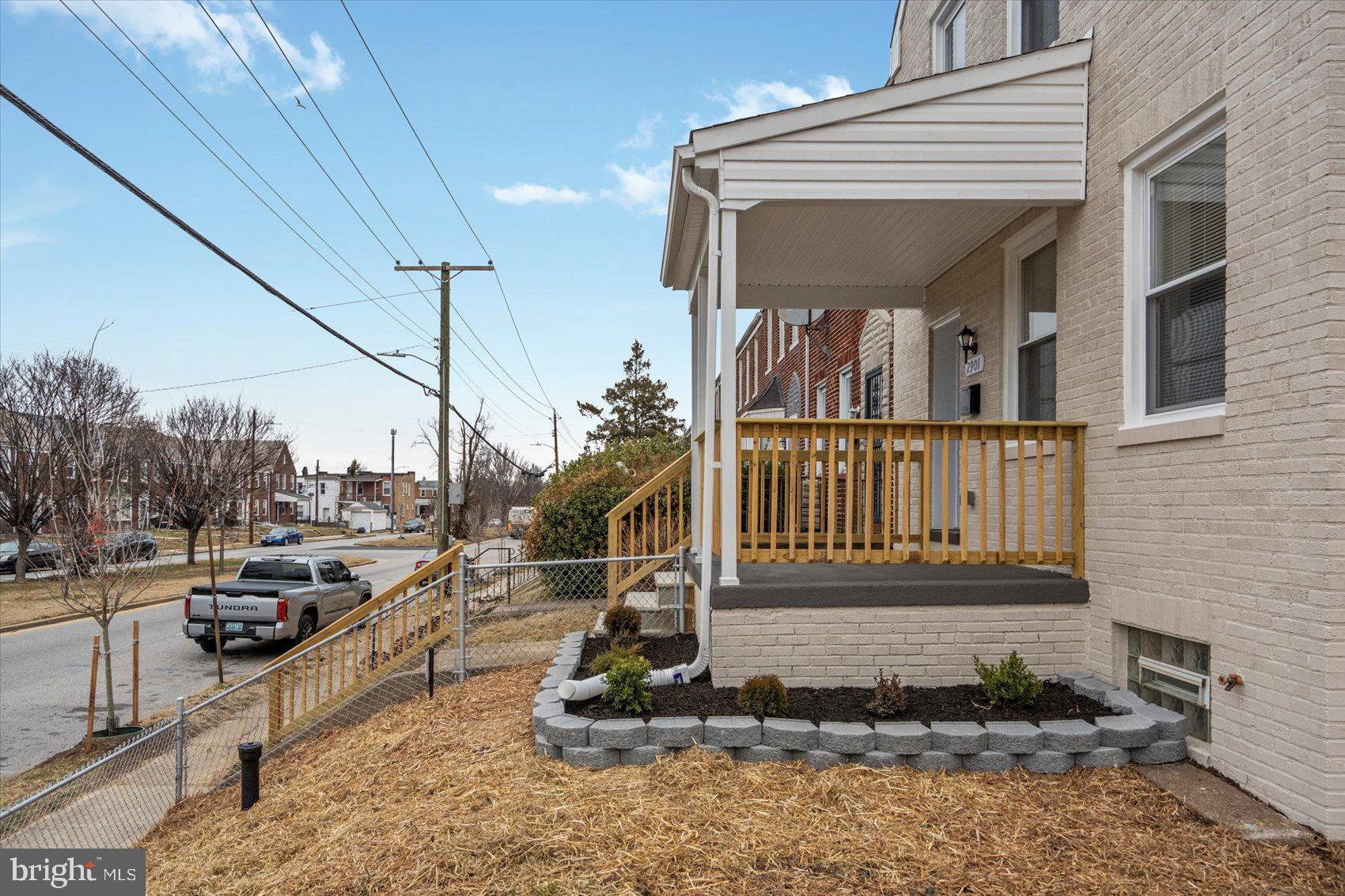2901 Edison Highway Baltimore, MD 21213 - Photo 47 of 52 a view of a house with a cars park side of a road
