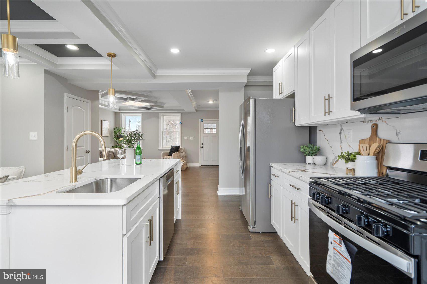 2901 Edison Highway Baltimore, MD 21213 - Photo 10 of 52 a kitchen with stainless steel appliances granite countertop a sink stove and refrigerator