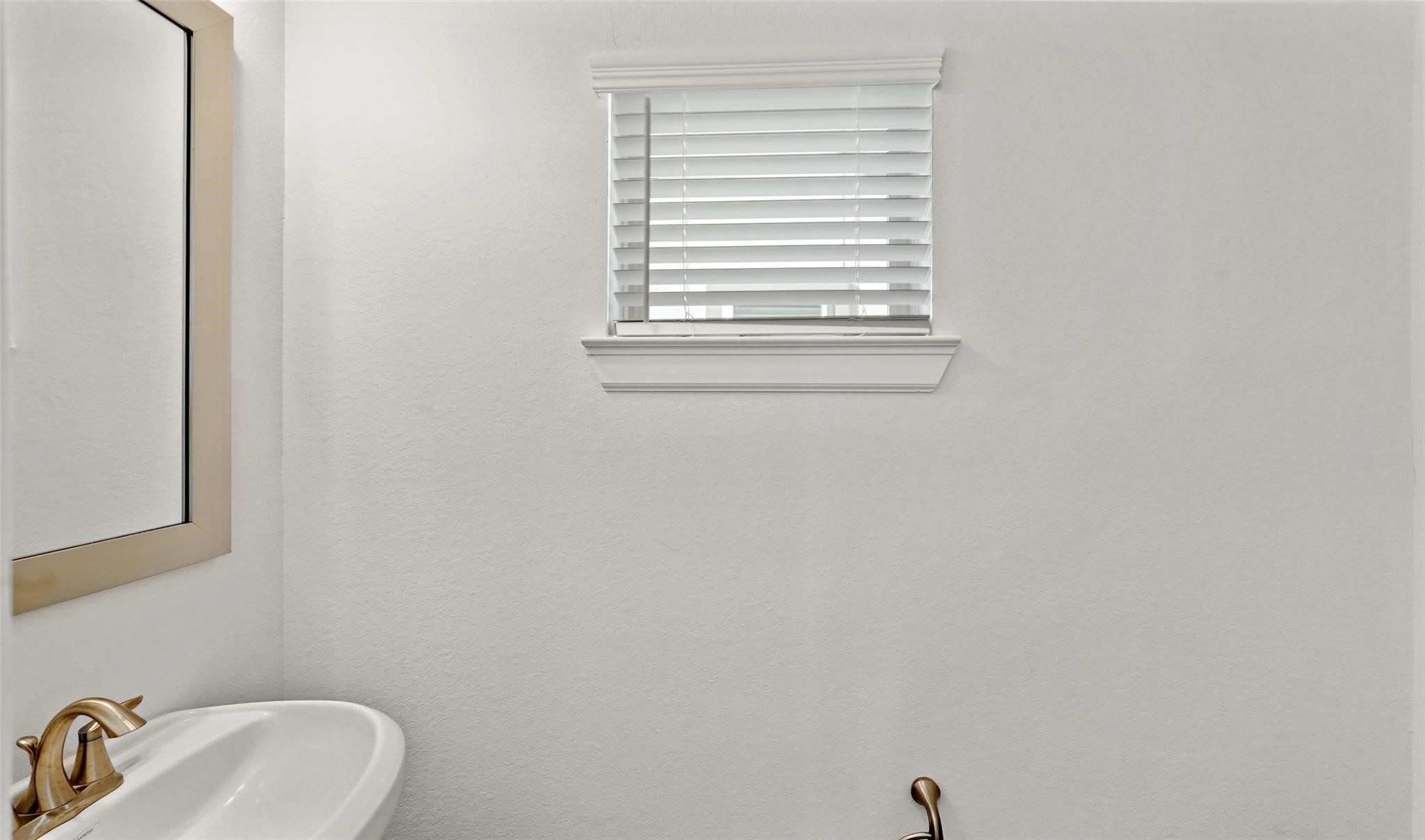 10609 Centre Green Way Houston, TX 77043 - Photo 16 of 27 a bathroom with a sink and a vanity