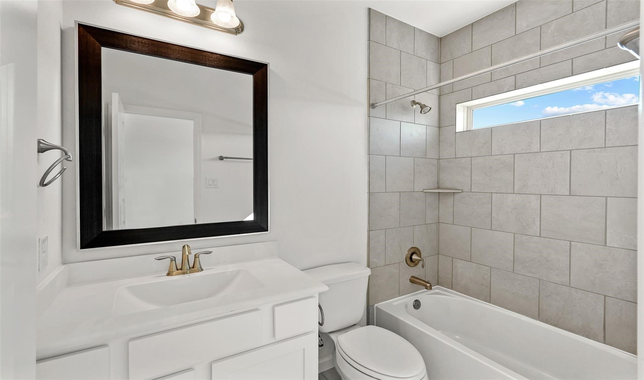 10609 Centre Green Way Houston, TX 77043 - Photo 20 of 27 a bathroom with a bathtub shower sink vanity and toilet