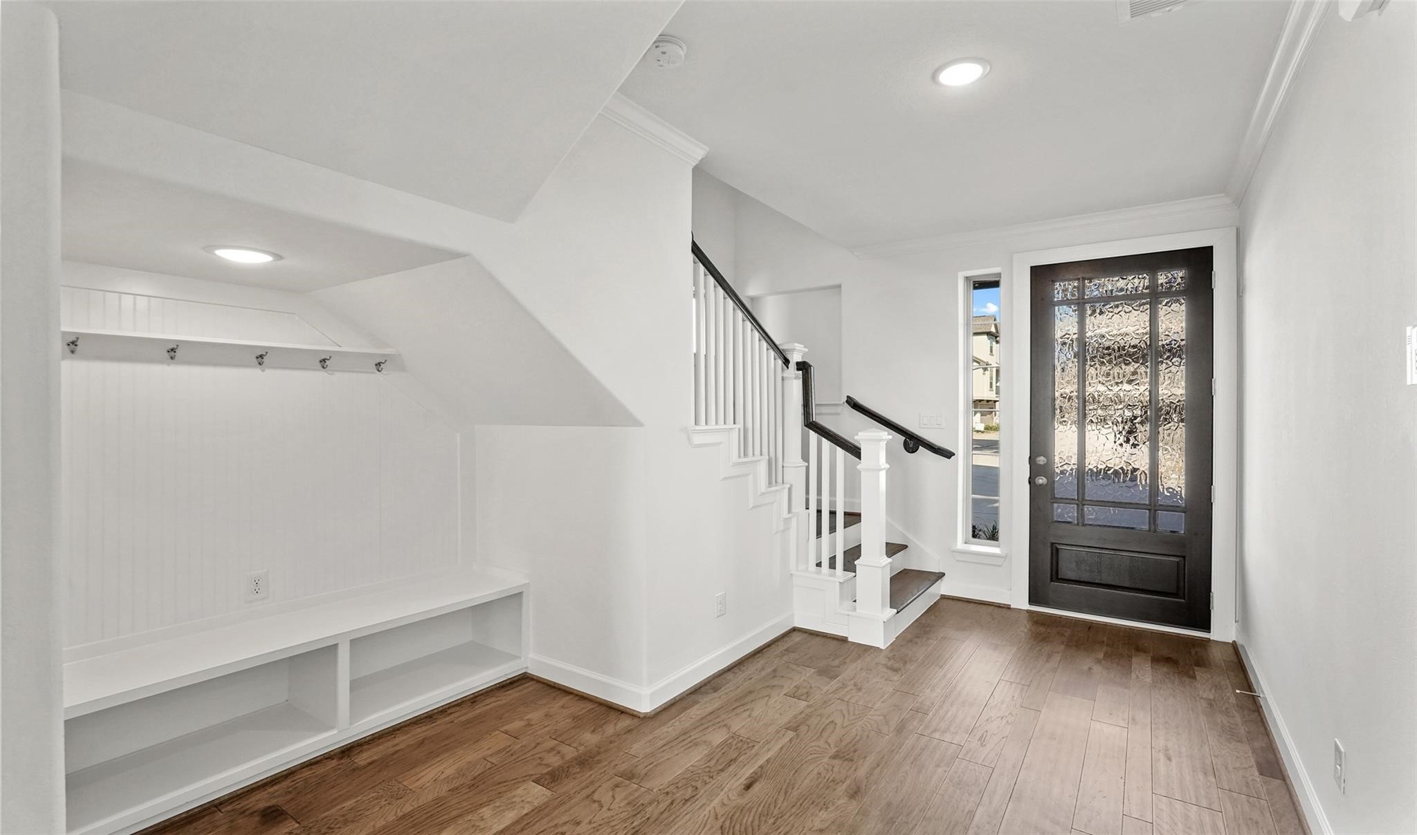 10609 Centre Green Way Houston, TX 77043 - Photo 3 of 27 a view of entryway with stairs and wooden floor