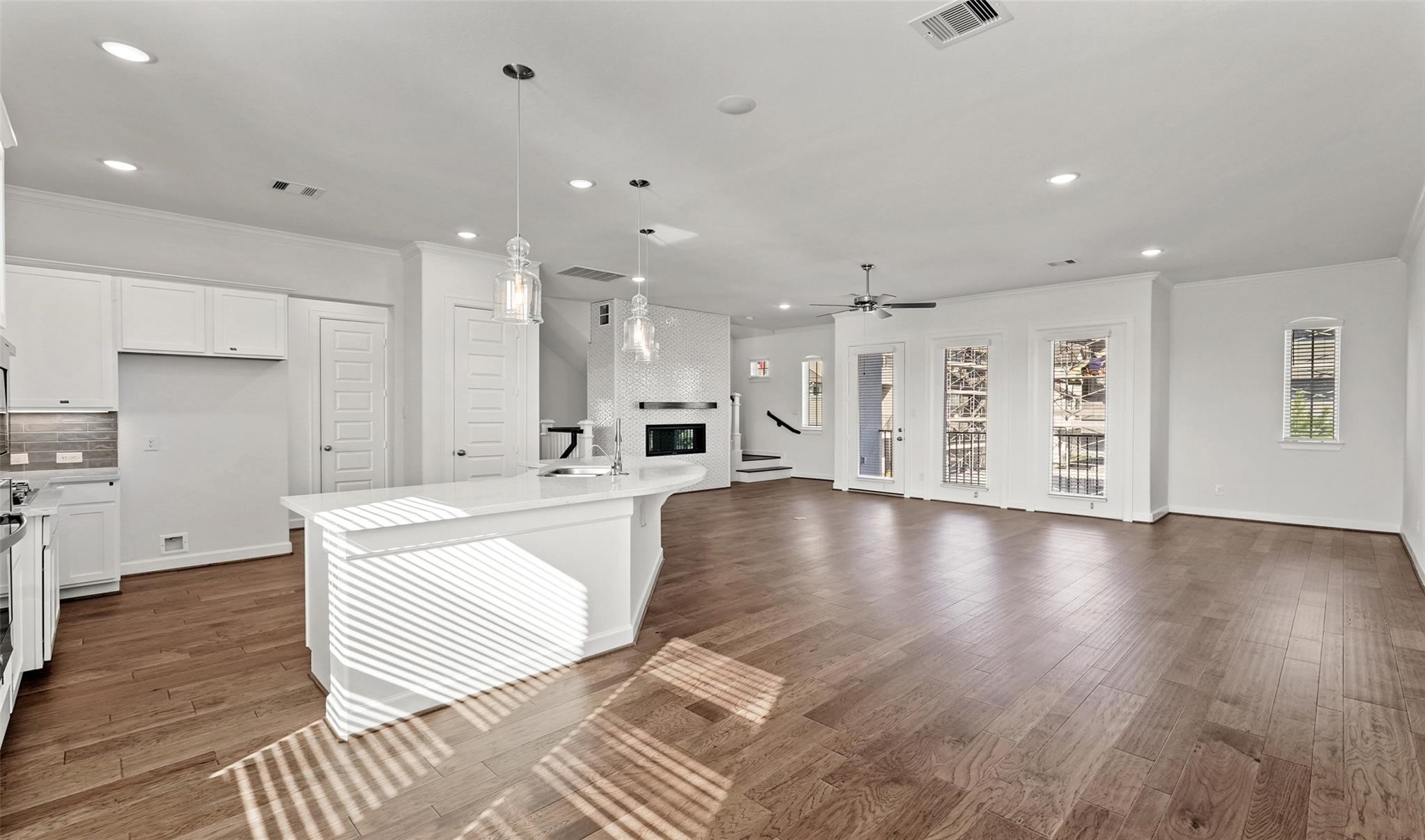 10609 Centre Green Way Houston, TX 77043 - Photo 7 of 27 a large kitchen with a lot of counter space and a wooden floor