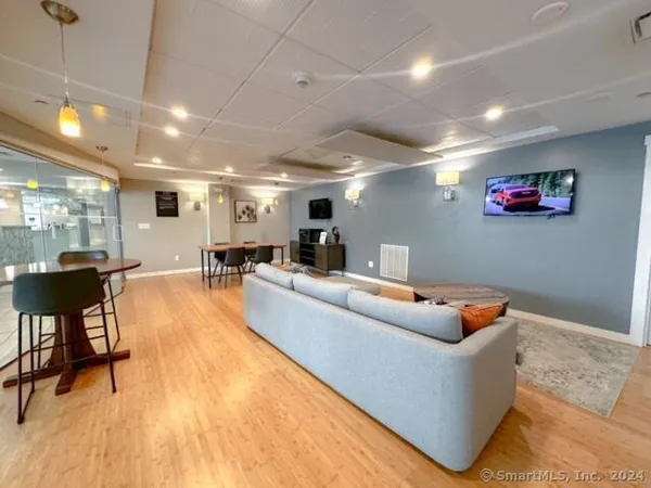 a bathroom with a granite countertop toilet a sink and a bathtub