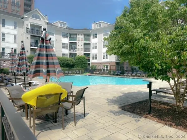 a view of a backyard with a table and chairs