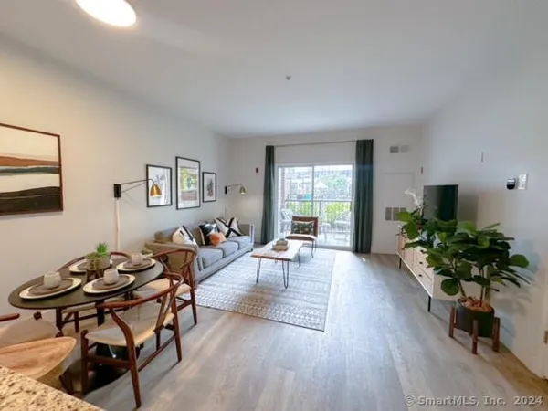 a view of a swimming pool with sitting area