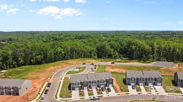 a view of house with outdoor space and swimming pool