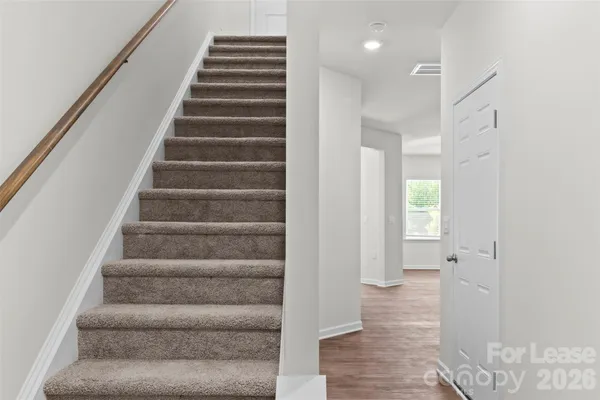 a view of an entryway with wooden floor