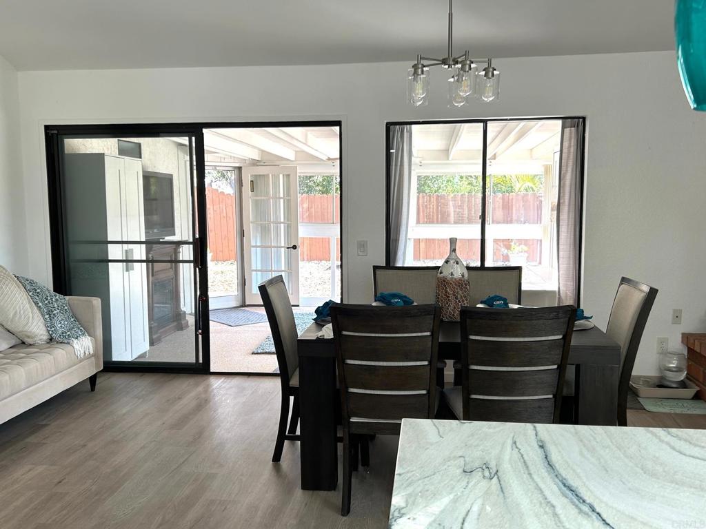 3594 Newland Road Oceanside, CA 92056 - Photo 15 of 44 a view of a dining room with furniture and a window
