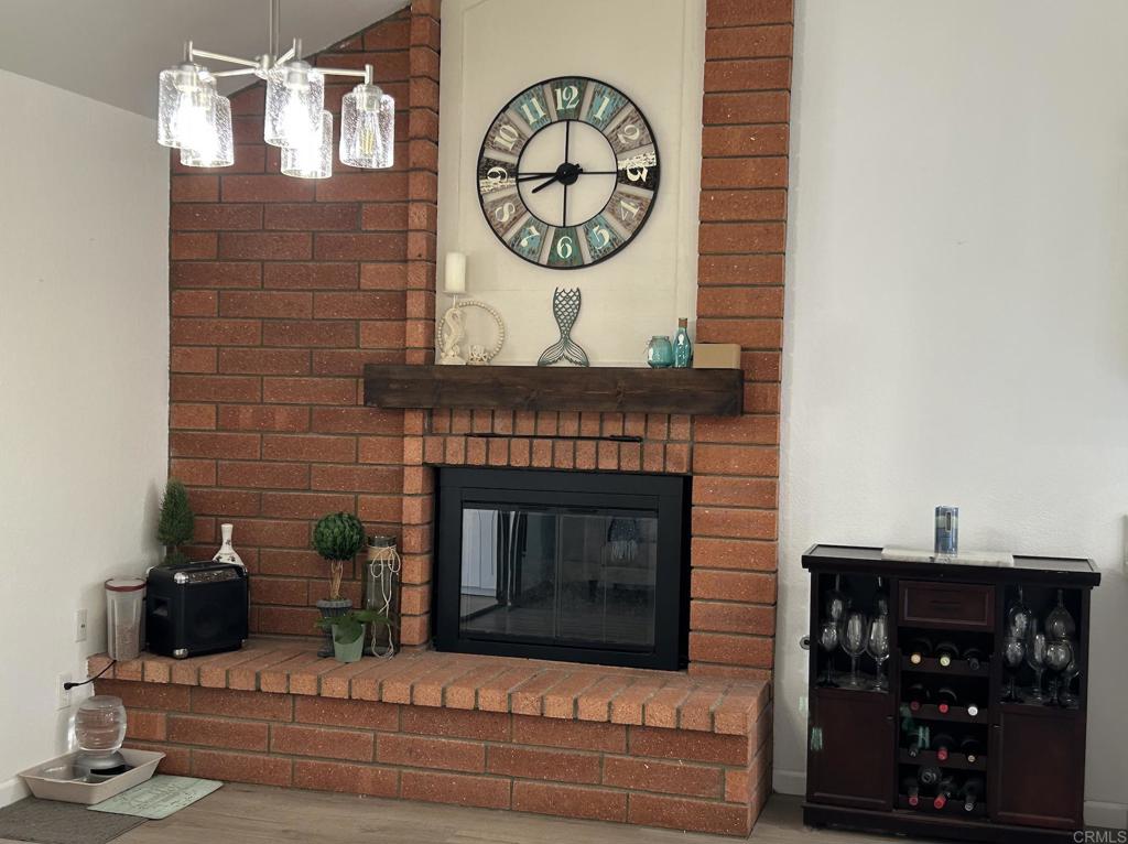 3594 Newland Road Oceanside, CA 92056 - Photo 18 of 44 a living room with furniture and a fireplace