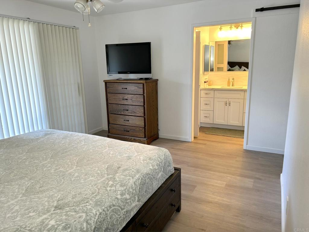 3594 Newland Road Oceanside, CA 92056 - Photo 25 of 44 a bedroom with a bed and flat screen tv