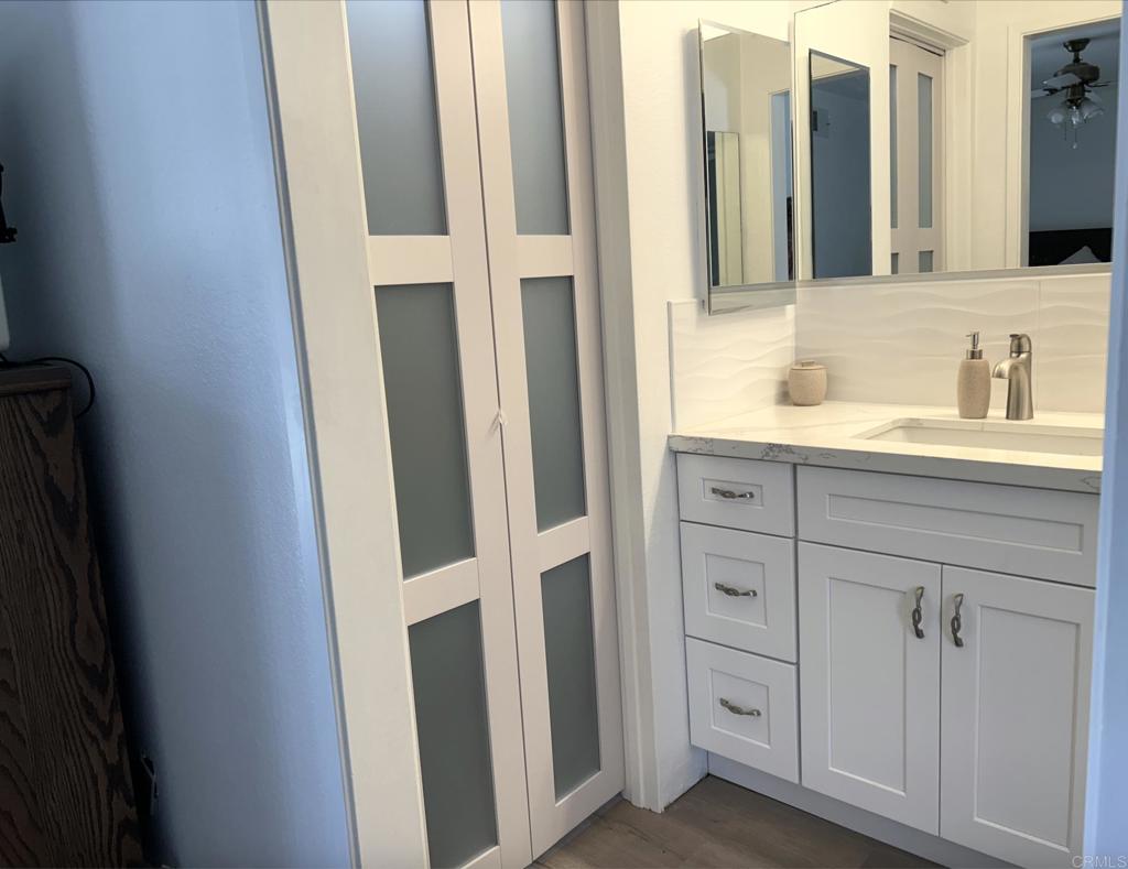 3594 Newland Road Oceanside, CA 92056 - Photo 27 of 44 a bathroom with a sink and a mirror