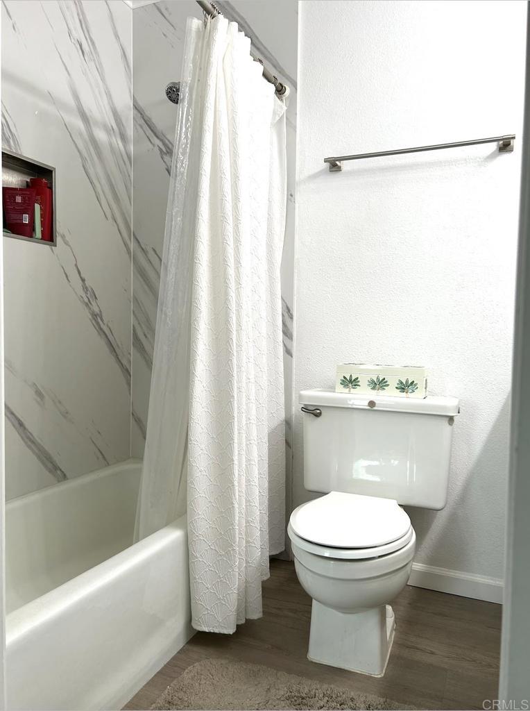 3594 Newland Road Oceanside, CA 92056 - Photo 35 of 44 a bathroom with a white toilet and a shower