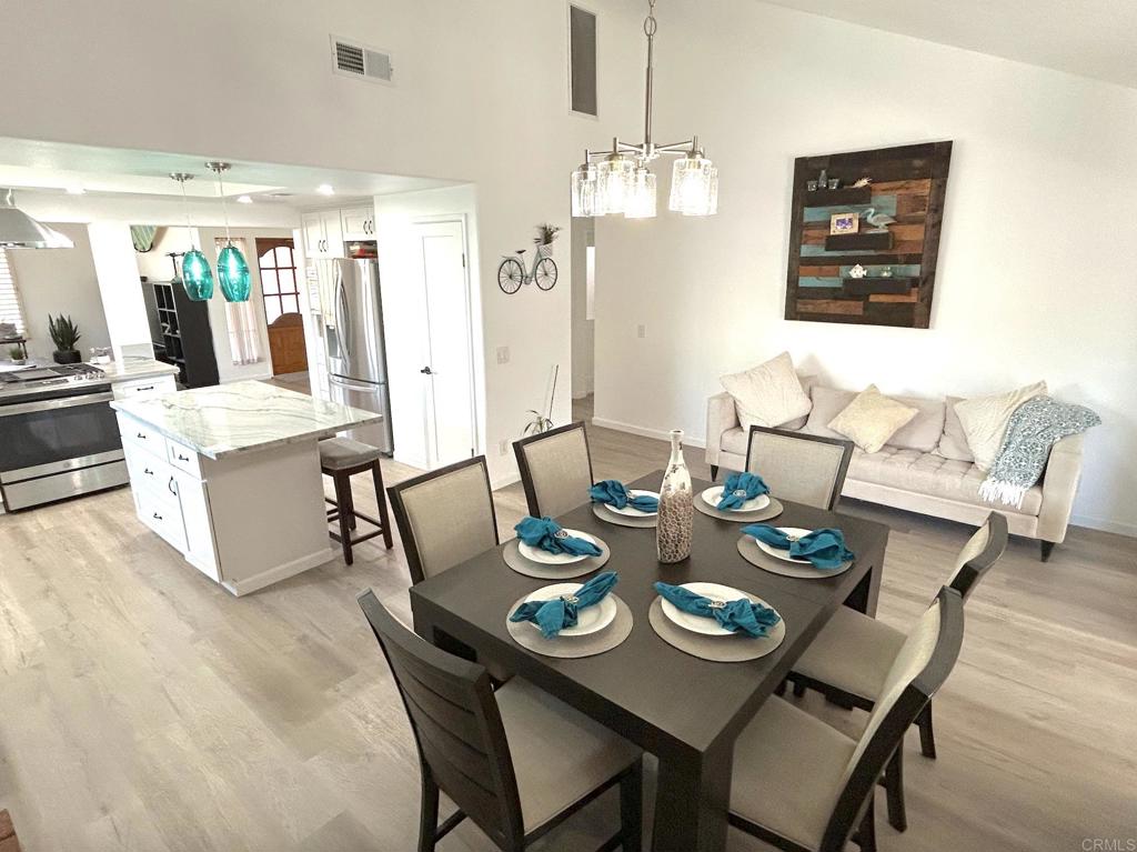 3594 Newland Road Oceanside, CA 92056 - Photo 4 of 44 a view of a dining room with furniture and chandelier
