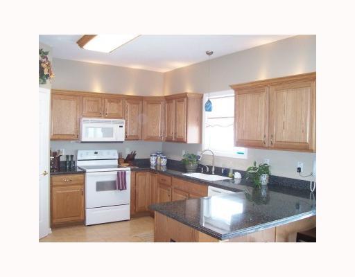 Kitchen. LOTS OF CABINETS, UNDER AND OVER CABINET LIGHTING, CORIAN COUNTER TOPS