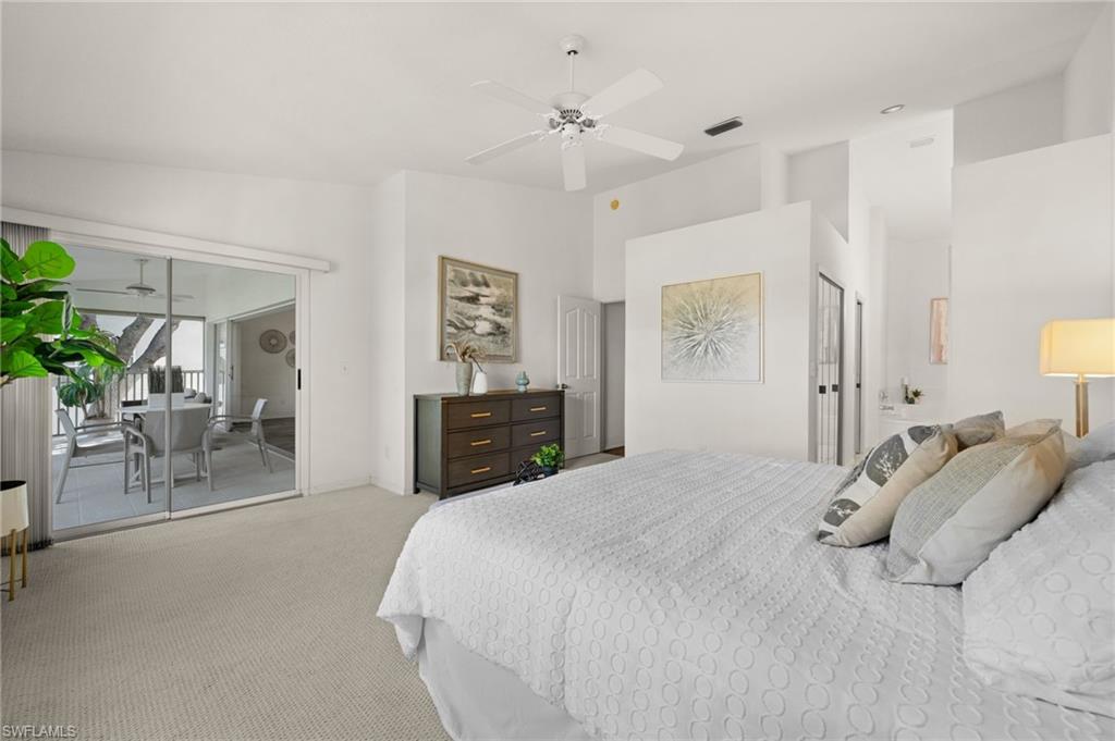 13100 Hamilton Harbour Drive, Unit G11 Naples, FL 34110 - Photo 19 of 32 a spacious bedroom with a bed and furniture