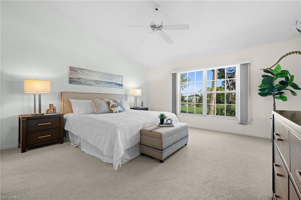 13100 Hamilton Harbour Drive, Unit G11 Naples, FL 34110 - Photo 20 of 32 a spacious bedroom with a bed and a window