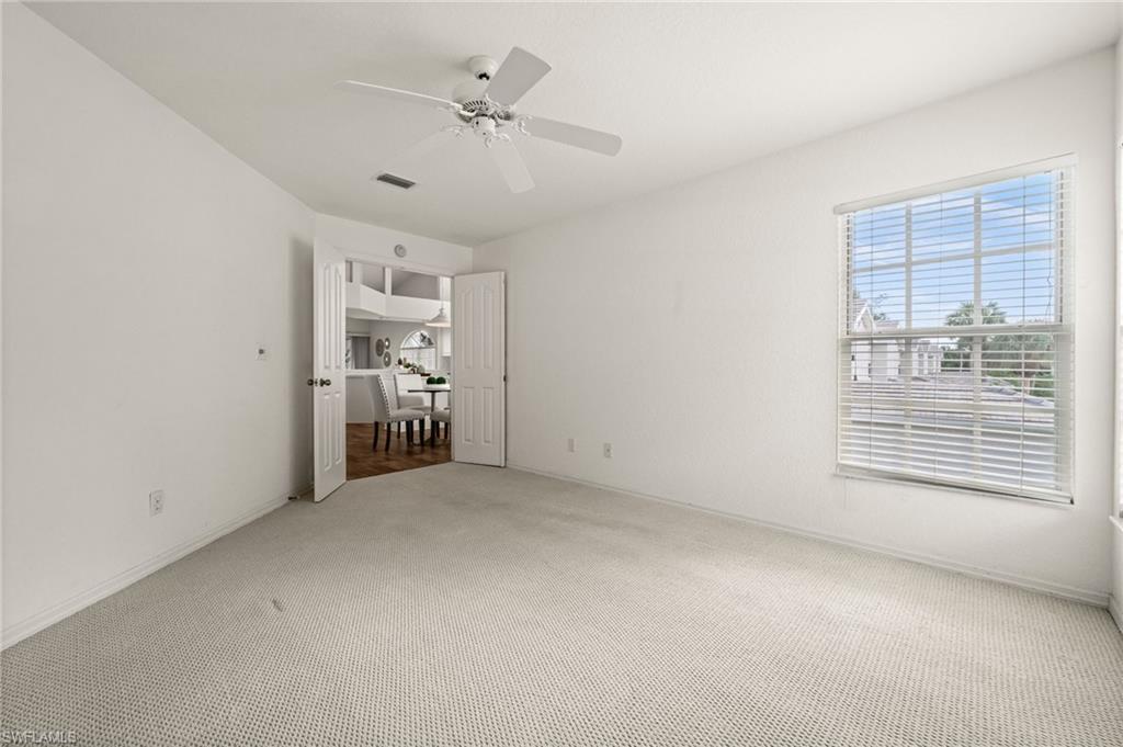 13100 Hamilton Harbour Drive, Unit G11 Naples, FL 34110 - Photo 23 of 32 a view of an empty room with a window