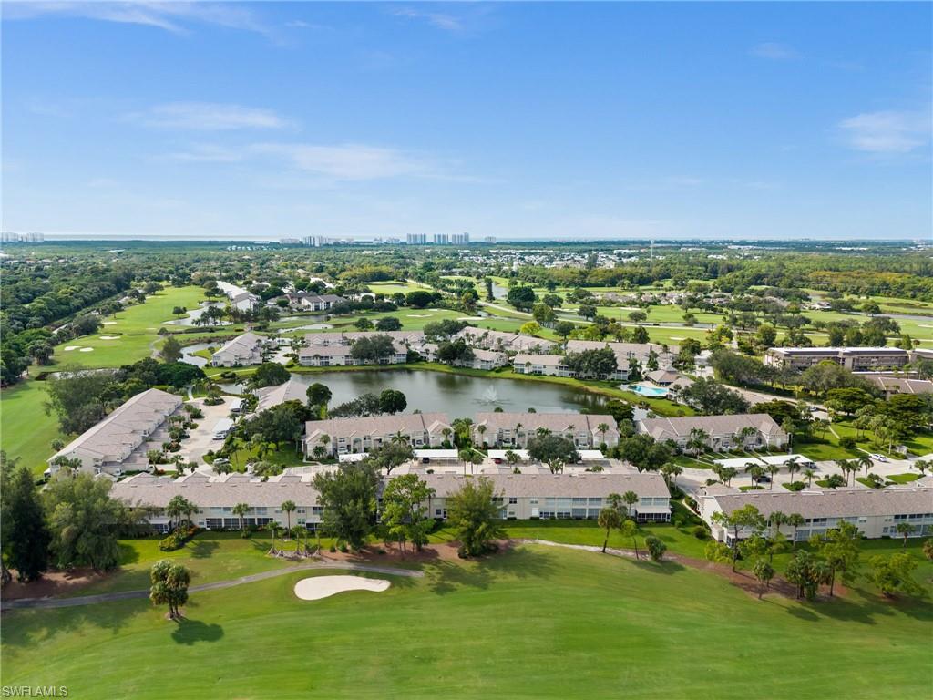13100 Hamilton Harbour Drive, Unit G11 Naples, FL 34110 - Photo 29 of 32 an aerial view of a houses with a lake view