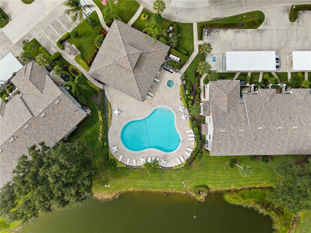 13100 Hamilton Harbour Drive, Unit G11 Naples, FL 34110 - Photo 30 of 32 an aerial view of a house with a swimming pool
