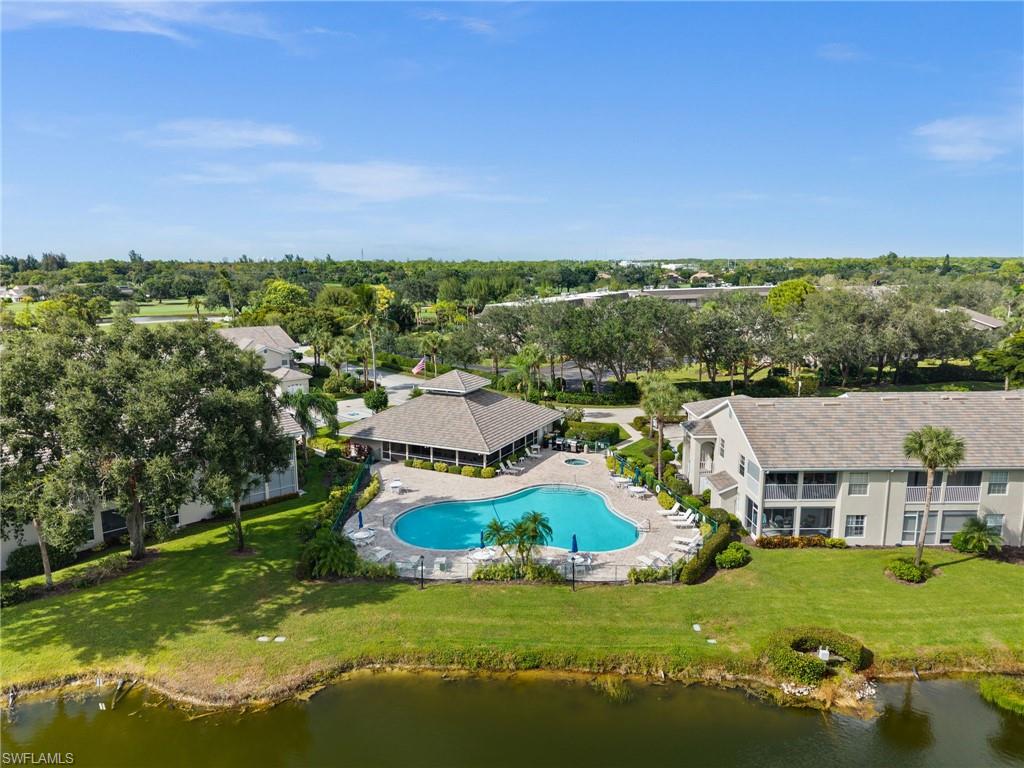 13100 Hamilton Harbour Drive, Unit G11 Naples, FL 34110 - Photo 31 of 32 a view of a house with a big yard