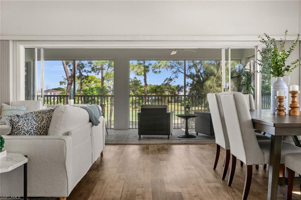 13100 Hamilton Harbour Drive, Unit G11 Naples, FL 34110 - Photo 8 of 32 a living room with furniture and a window