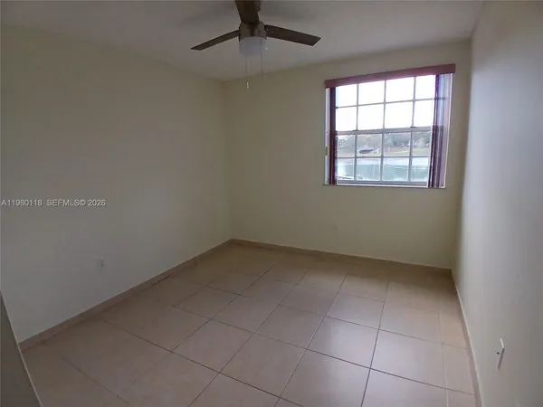 an empty room with a empty space and a window