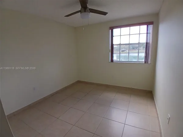 an empty room with a empty space and a window