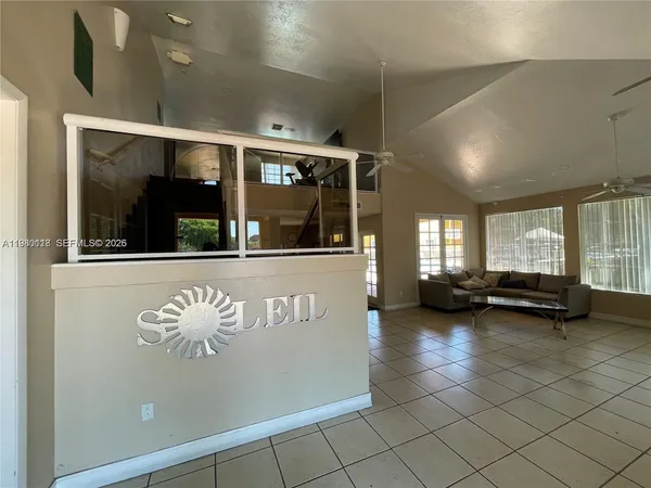 a view of a swimming pool with a house