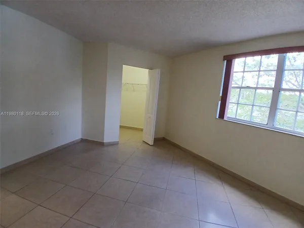 a view of an empty room with a window