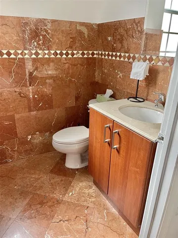 a view of bathroom with a sink and toilet