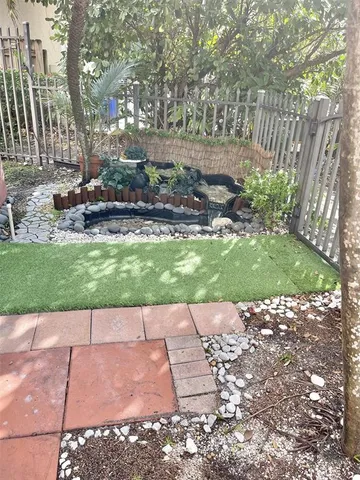 a view of a backyard with large trees