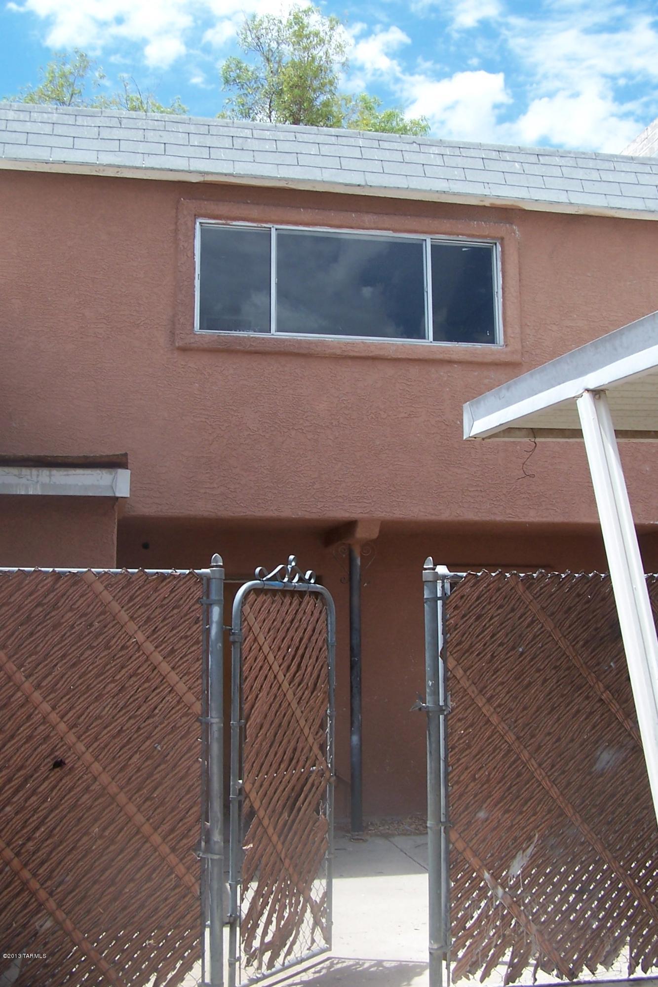 3504 South Mission Road, Unit J Tucson, AZ 85713 - Photo 1 of 1 a room with a chair