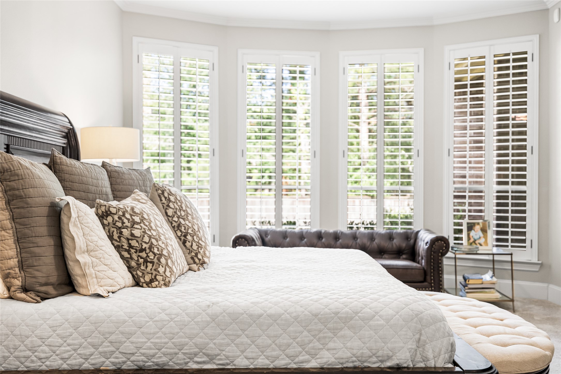 3 Mohawk Path Place Spring, TX 77389 - Photo 9 of 38 Featuring plantation shutters and new carpet, the spacious primary suite is a true retreat. Complete with a large en-suite bathroom and an enormous walk-in closet, this is the perfect space to relax and unwind.