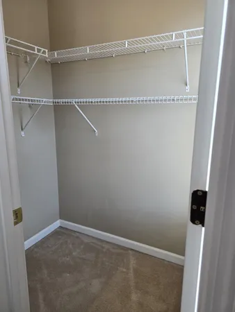 a view of an empty walk in closet