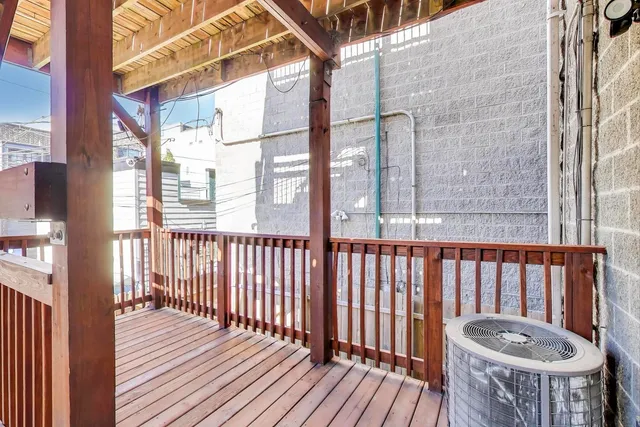 a view of a balcony with wooden floor