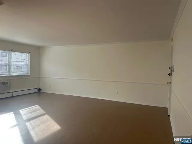 an empty room with a empty space and window