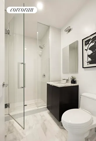 a bathroom with a toilet sink and shower