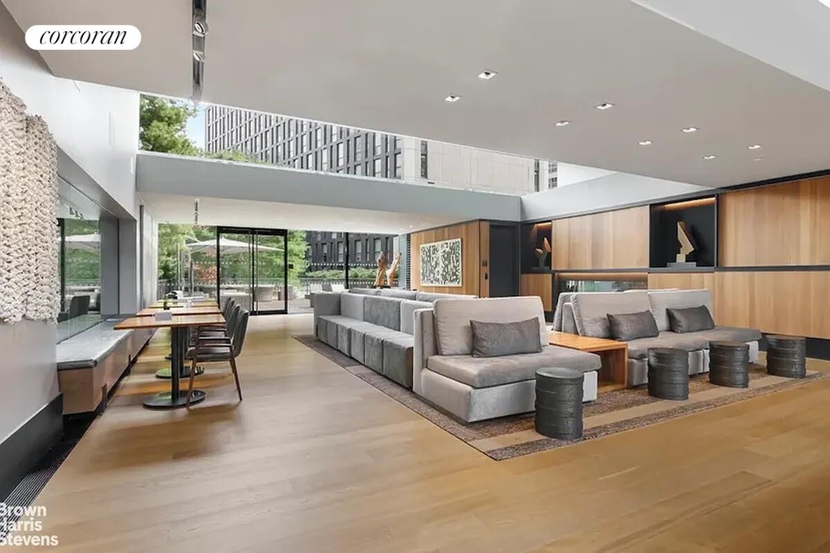101 Warren Street, Unit 1450 Manhattan, NY 10007 - Photo 14 of 20 a living room with furniture kitchen view and a large window