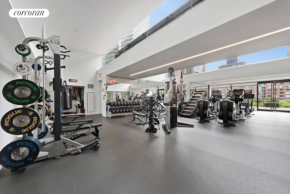 101 Warren Street, Unit 1450 Manhattan, NY 10007 - Photo 15 of 20 a view of a room with gym equipment