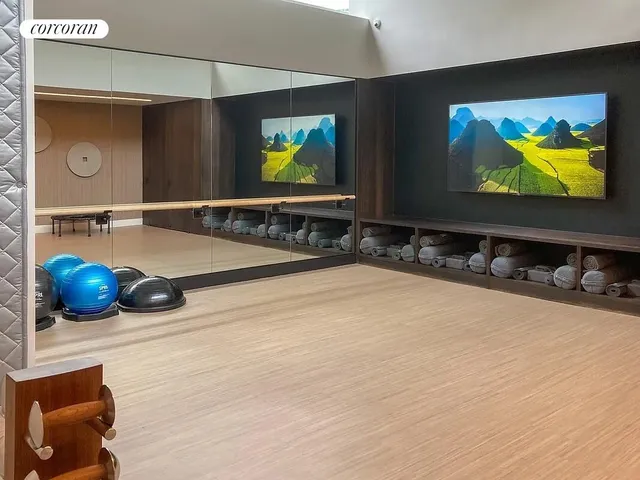 a room with pool table and wall painting
