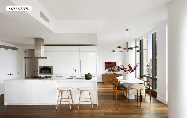a view of kitchen with cabinets and wooden floor