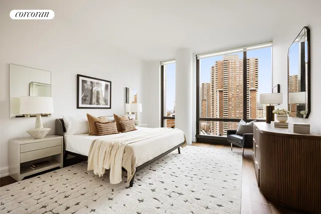 a bedroom with double bed and a window